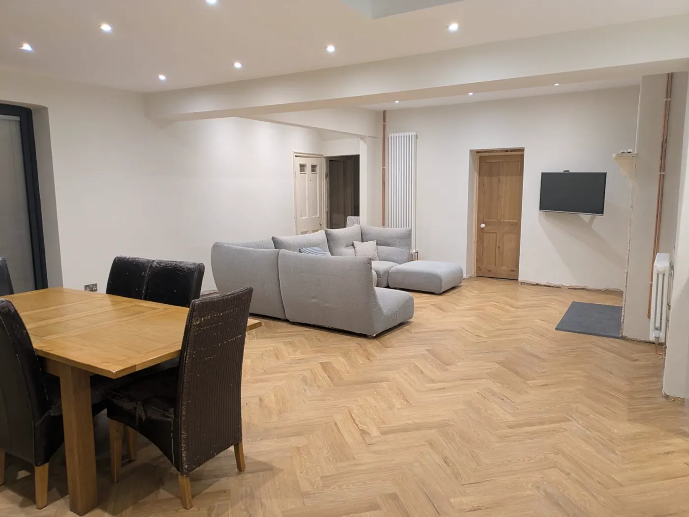 Completed open-plan home renovation with kitchen, dining and living space